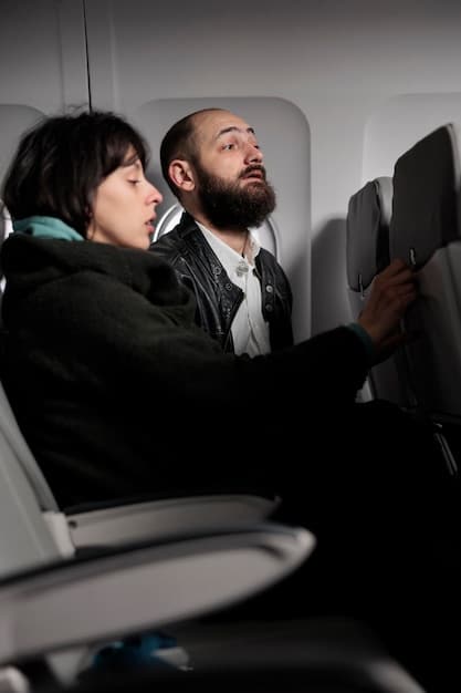 A flight instructor is shown explaining the workings of a flight simulator to a group of pilot trainees. The simulator screen displays a realistic aerial view, and the instructor is pointing to different controls.