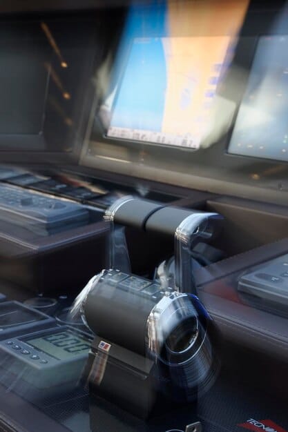 A detailed cockpit view of an F-35 Lightning II, showcasing its advanced panoramic touchscreens and helmet-mounted display, emphasizing the sensor fusion and data presentation to the pilot.