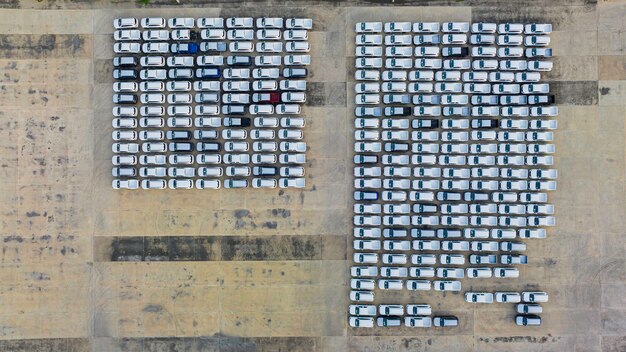 An aerial view of a large, sprawling defense manufacturing facility with several partially assembled military aircraft visible. The image conveys the scale of defense production and the potential for disruption due to component shortages, emphasizing the large-scale integration of technology within these systems.