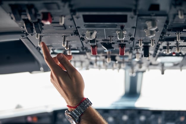 A close-up of a technician's hands working with cables and circuit boards inside an aircraft. The technician is wearing an anti-static wrist strap, and the focus is on the intricate electronic components being handled. This shot emphasizes the intricate hardware that requires robust cybersecurity for Analyzing the Cybersecurity Vulnerabilities of Modern Military Aircraft Systems.