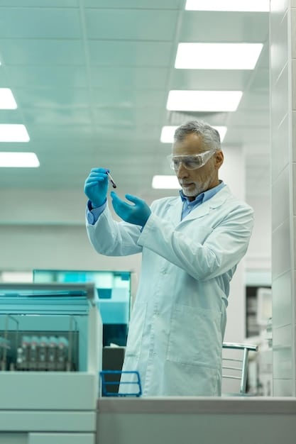 A lab technician in a cleanroom environment working with bioreactors filled with genetically engineered microorganisms. The bioreactors are equipped with sensors and controls, and the technician is carefully monitoring the production process. This illustrates the controlled environment required for The Role of Synthetic Biology in Developing Advanced Military Materials.