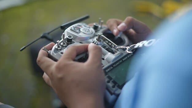 Close-up of a soldier assembling a drone using 3D-printed components in a field workshop. The drone parts are various colors and materials, illustrating the versatility of additive manufacturing. The setting is a camouflaged tent with various tools visible, showing The Impact of Additive Manufacturing (3D Printing) on Military Equipment Production in real-world scenarios.