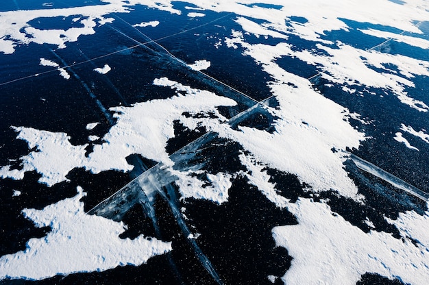 A satellite image showing the Arctic region with highlighted shipping routes and resource deposits, overlaid with national flags indicating the presence of various countries. This image portrays the intensified geopolitical competition in the Arctic, reflecting US Military's Focus on Arctic Warfare: Understanding the Strategic Implications.