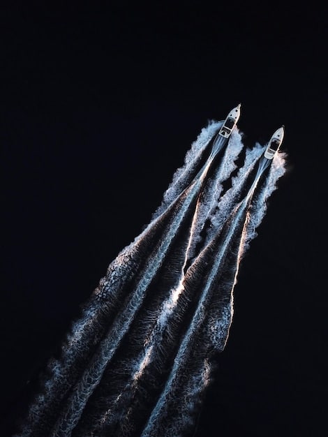 A decoy missile being launched from a warship. The decoy is emitting flares and creating a false radar signature to confuse incoming enemy missiles. The scene depicts a naval warfare scenario with a clear sky.