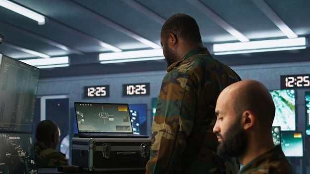 A close-up photograph of a US military technician working on the control panel of a drone system. The panel is filled with screens displaying maps, sensor data, and flight telemetry. The technician is focused and wearing a headset, indicating active communication with the drone. The image captures the technical expertise required to operate and maintain these advanced systems.